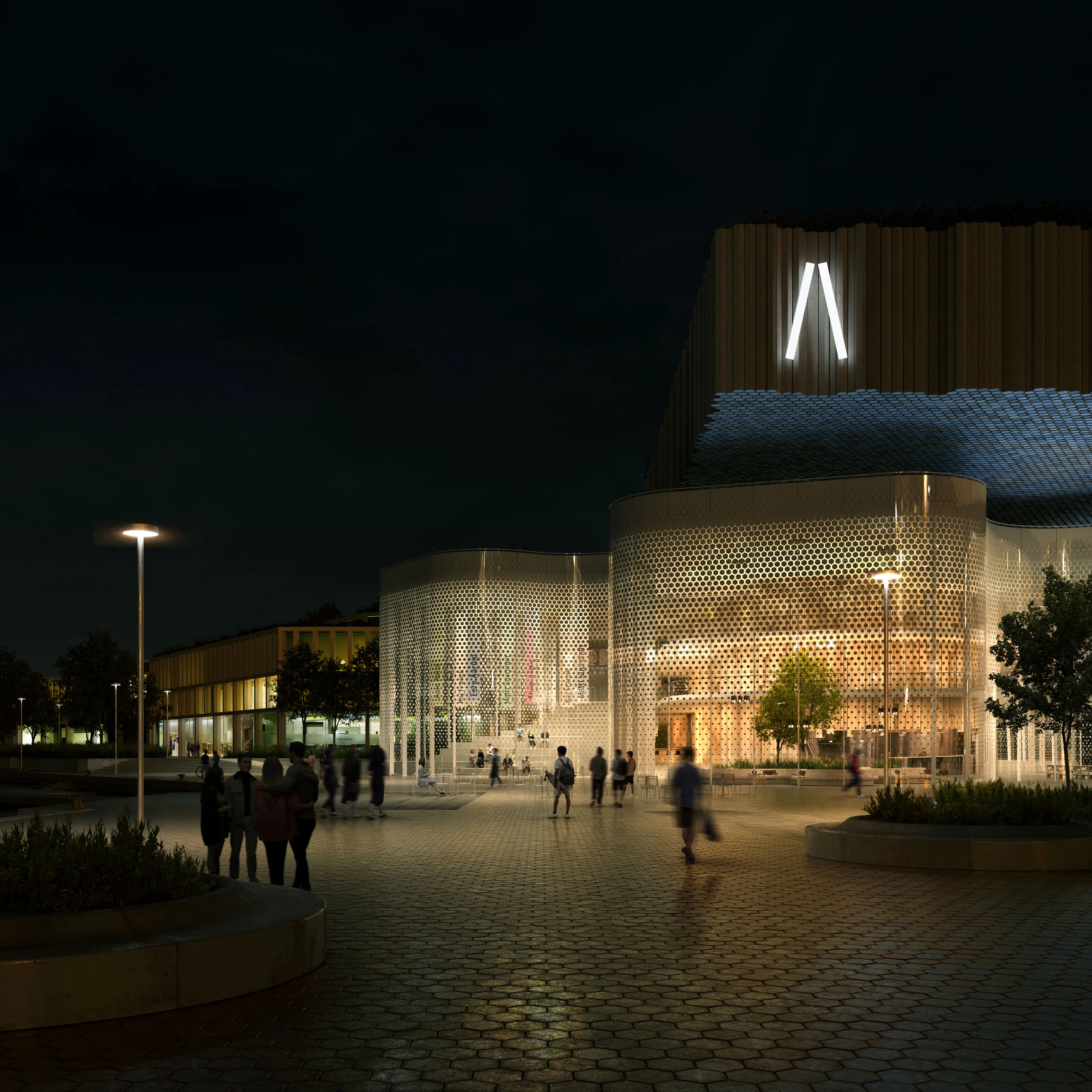 Night view of the Meltsinki cultural building with people in the foreground.